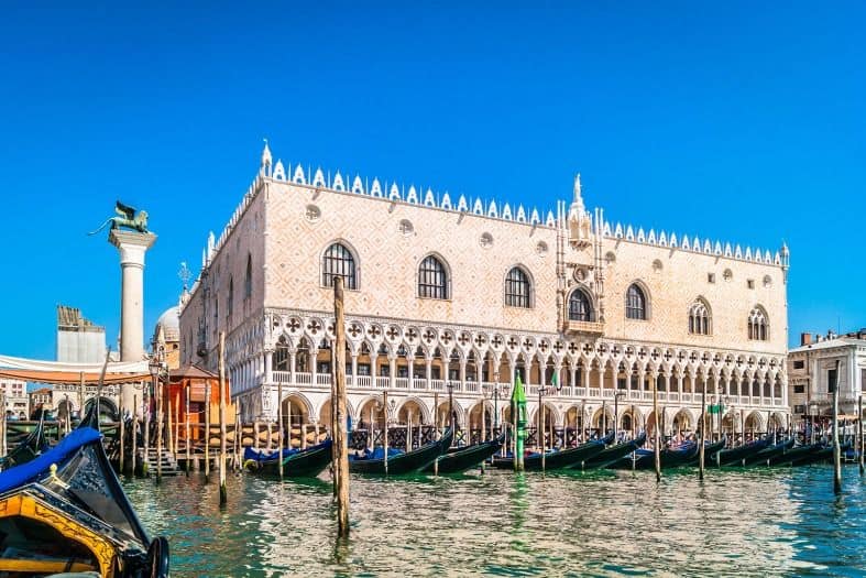 Doge's Palace in Venice with gondolas in front of it