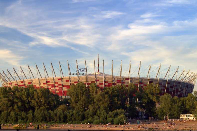 big football stadium in warsaw with river running past