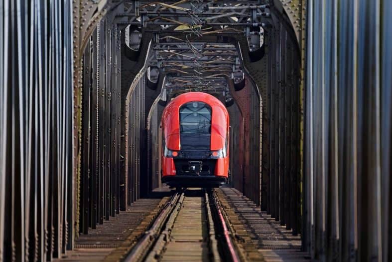 A red train commuting in Poland