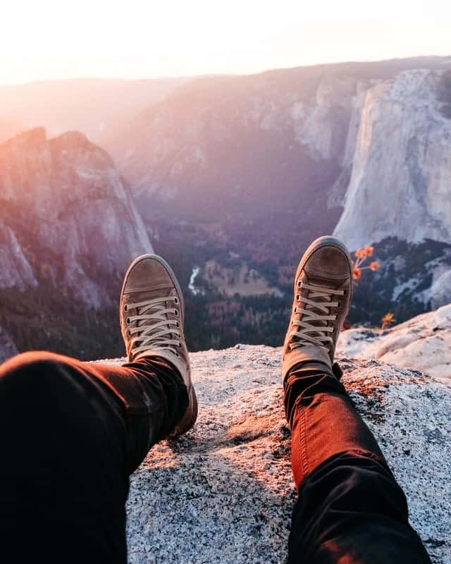 a teenager at a lookout in Yosemite National Park. Day trips for San Francisco with teenagers include Yosemite