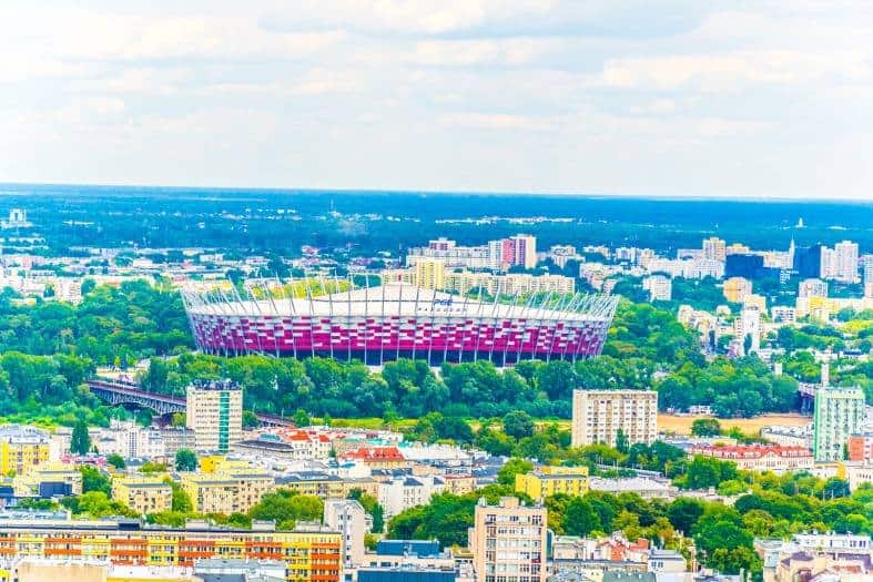 The Warsaw PGE National Stadium from a distance with its striking red facade