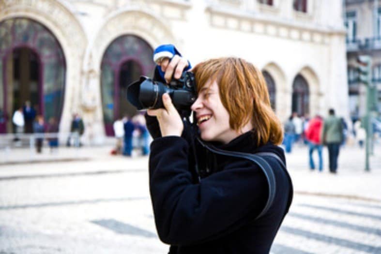 A teenager taking pictures in Lisbon