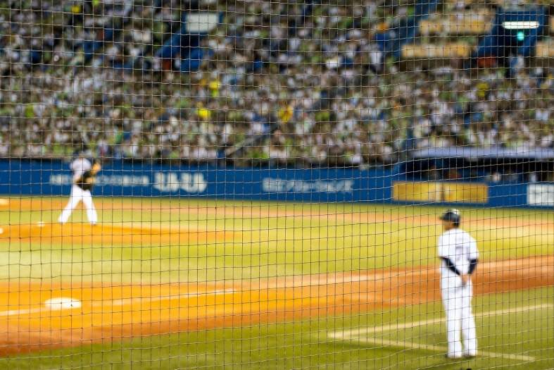 full stadium of people in Tokyo watching baseball