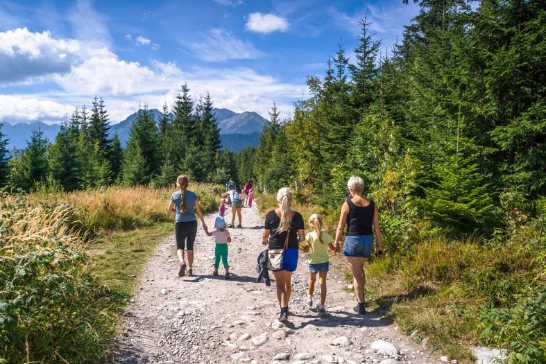 a family out on a summers day in Poland hiking