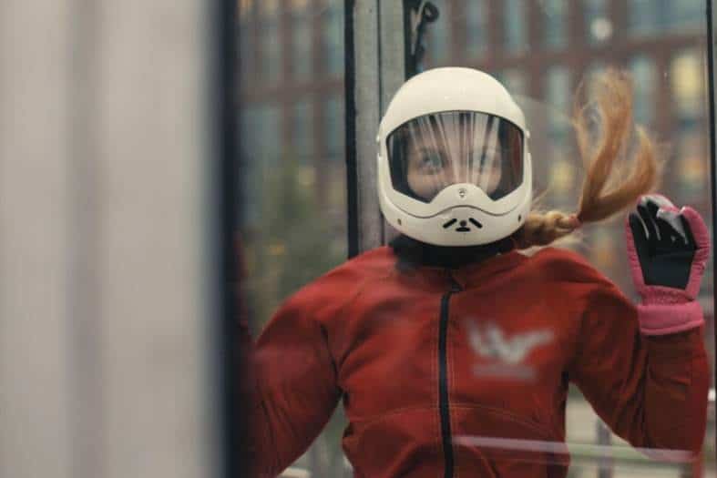 a teenage girl trying indoor sky diving