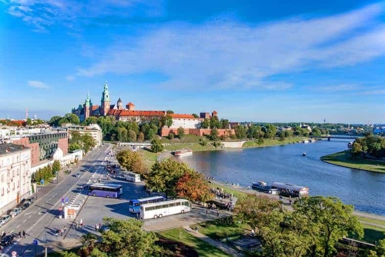 Sunny day in Krakow by the Vistula River with a castle in the background