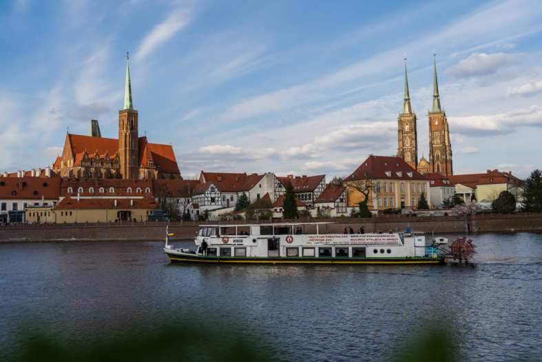 a boat cruising the river in Wroclaw