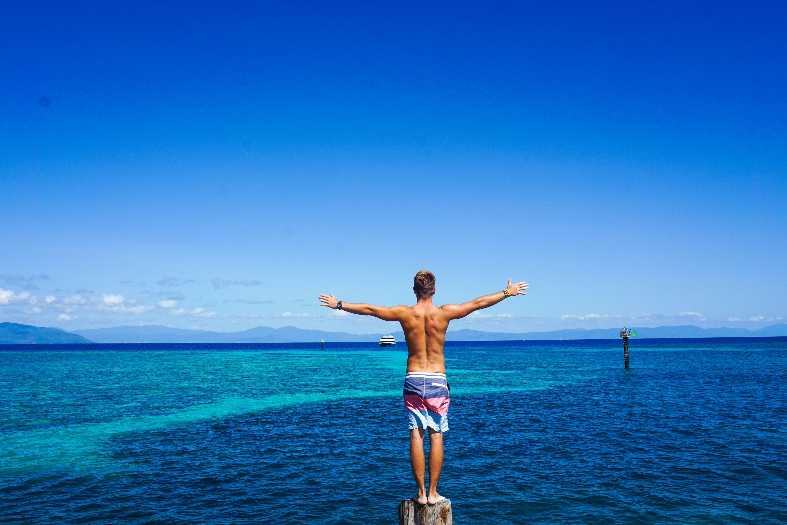 a teenage about to jump in the water near cairns Australia