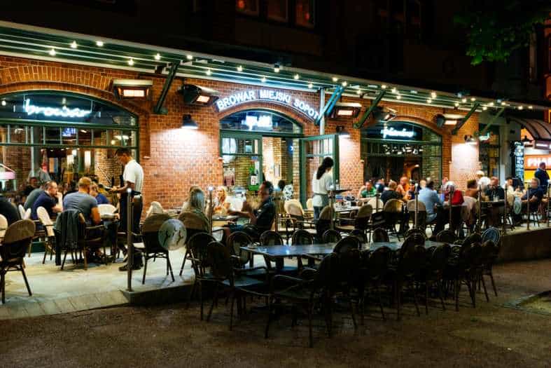 People out eating at night in Sopot Poland