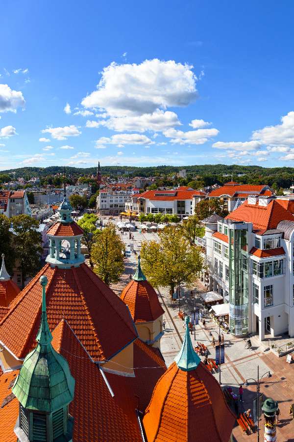 shopping area in Sopot, Poland showing mix of boutique stores, cafes, and a bustling atmosphere..